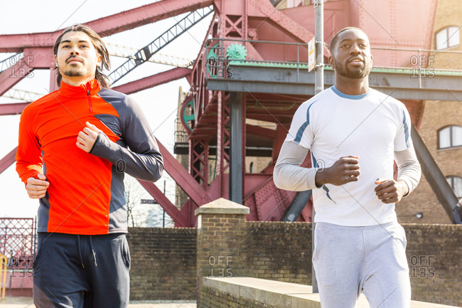 Two men jogging outdoors