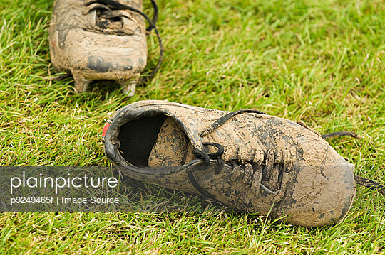 Muddy football boots