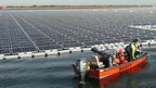 Boat at giant solar farm