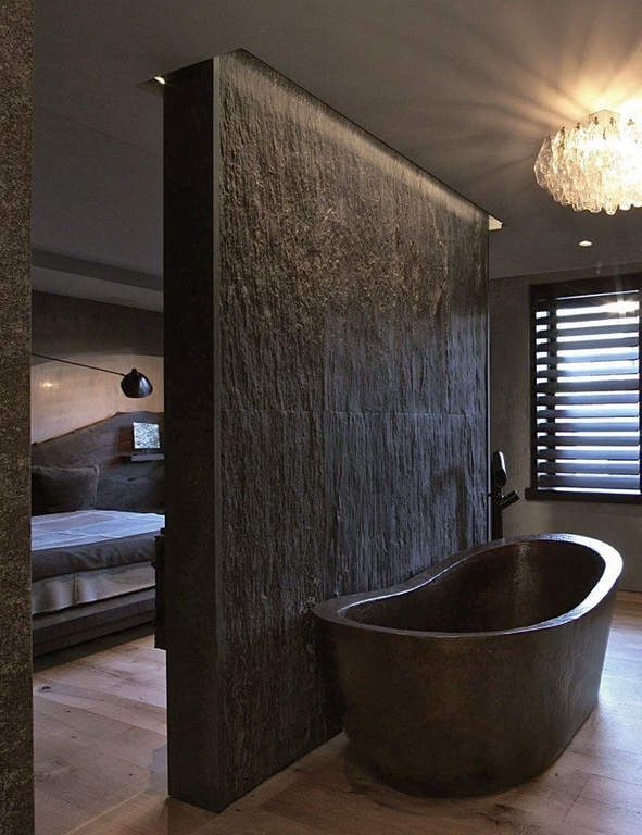 Rustic Master Bathroom with Stone Clad Wall & Copper Bathtub