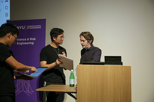 Students ask Professor Conall O'Sullivan questions during the Pre-Program Boot Camp