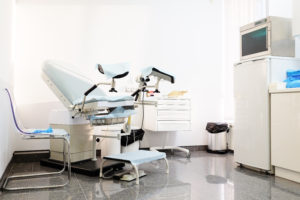 Gynecological chair in an exam room.