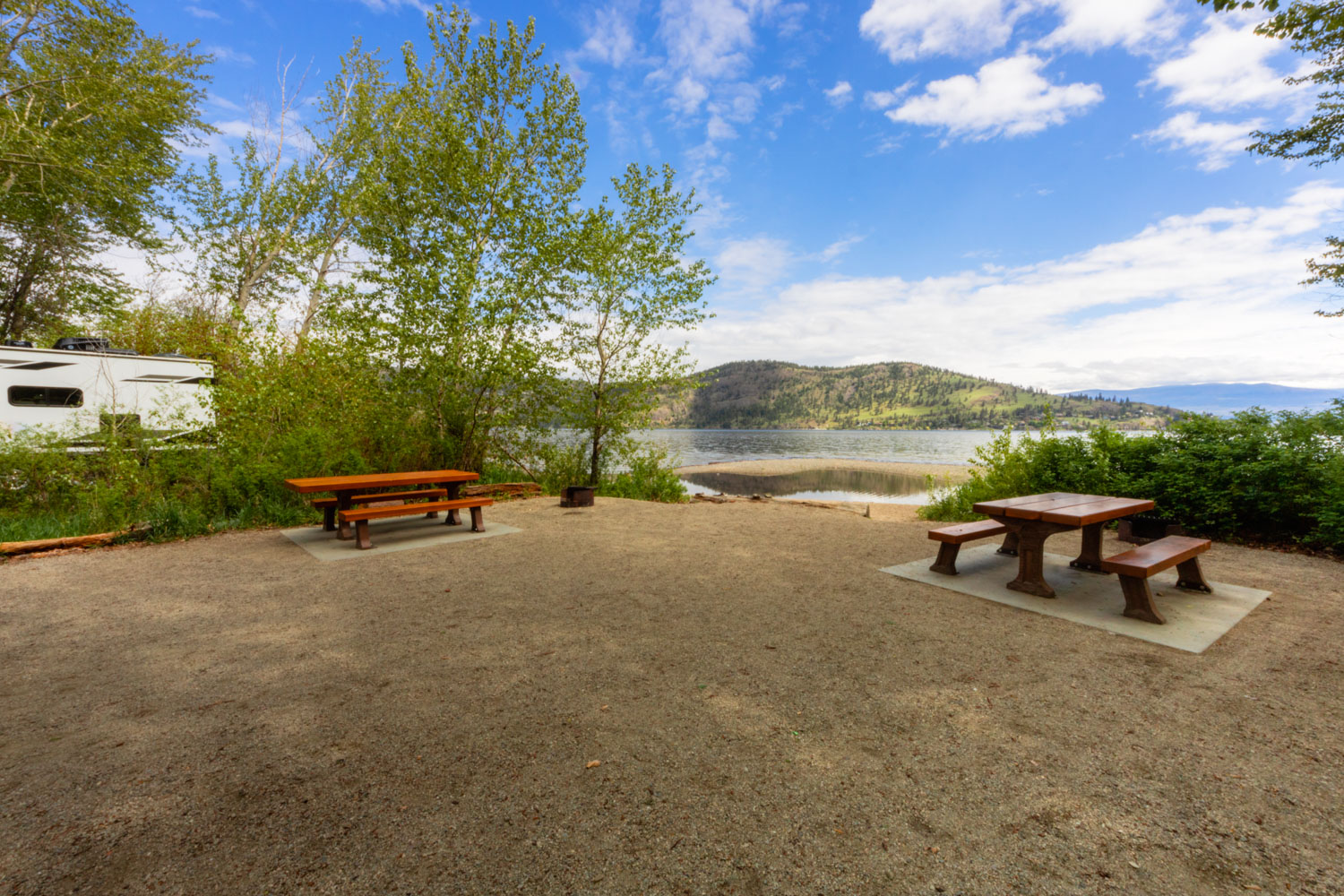 Lakeside campsite at Bear Creek with a blue sky