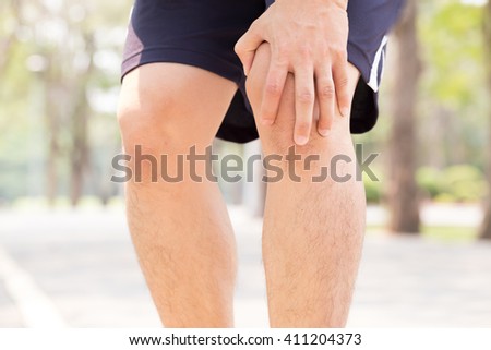 Man having knee pain while exercising