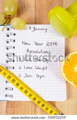 New years resolutions eat healthy, lose weight and join gym written in notebook, dumbbells for fitness with tape measure, concept of healthy lifestyle