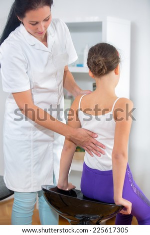 Chiropractor doing adjustment on female patient