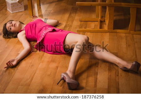 Crime scene simulation. Lifeless woman in a luxurious interior