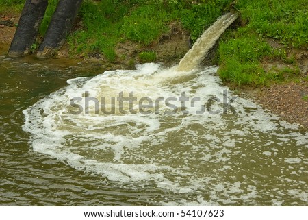 Dirty drains are dumped in water of small river