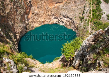 IMOTSKI, CROATIA - May, 31, 2012 - Red lake in Imotski, Croatia is a limestone crater, with it\'s cliffs 200 m high and lake 300 m deep.