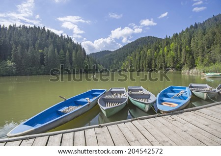 Boat docks on a beautiful lake in forest (Red Lake in Romania)