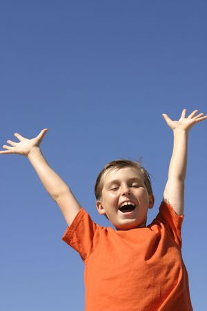 Child showing joy, praise, triumph, excitement - vertical