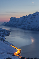 The moon was sinking and reflected in the fjord