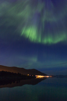 Green & blue beams above Tromsø island