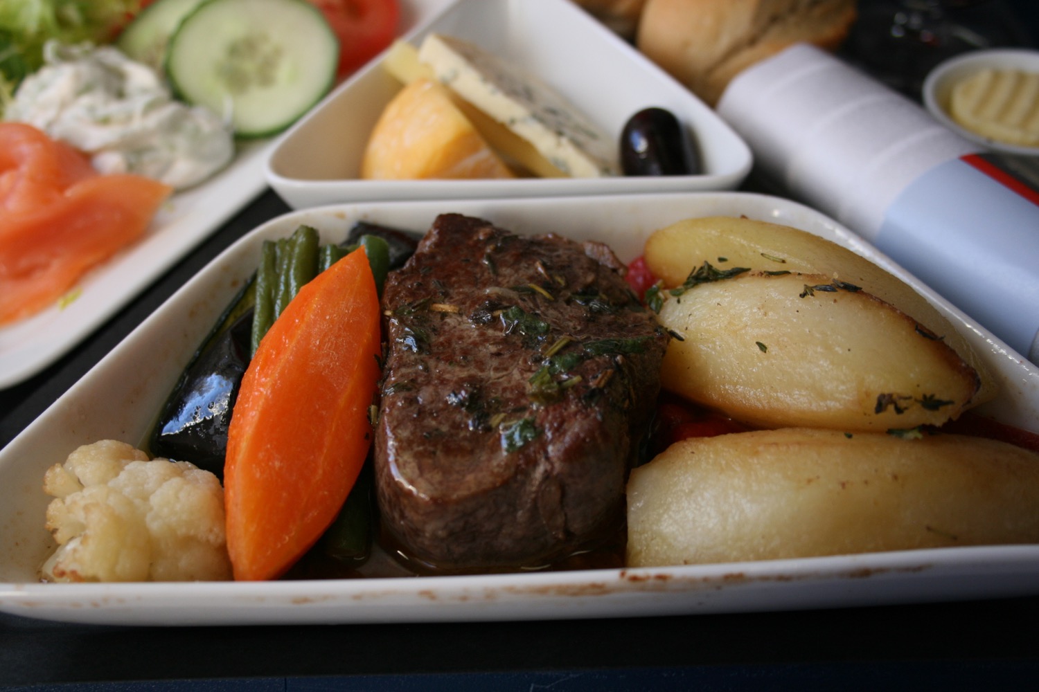 a plate of food with meat and vegetables