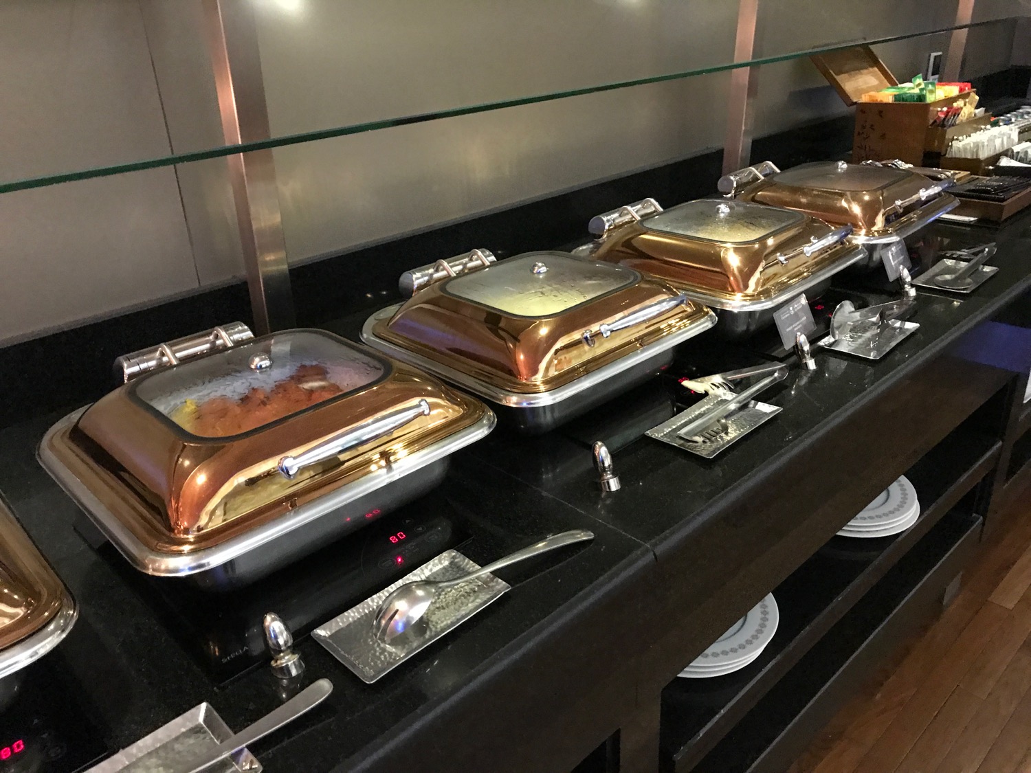 a row of food containers on a counter