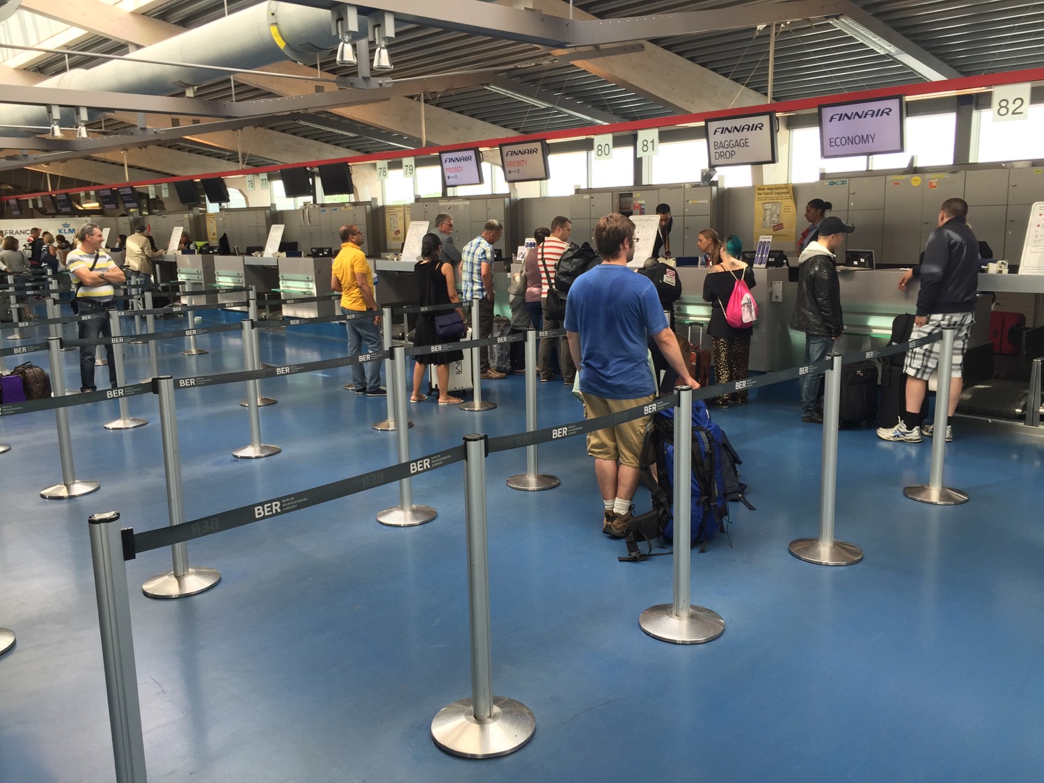 people standing in line at an airport