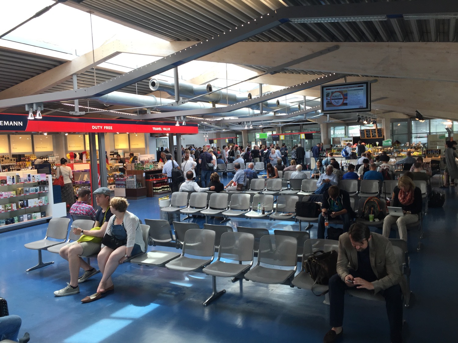 a group of people sitting in a terminal