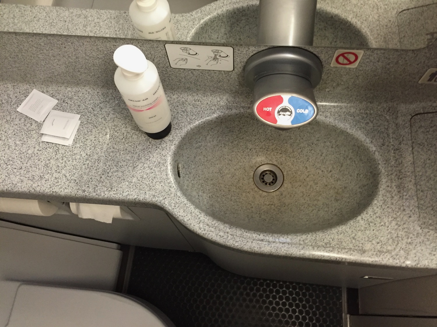 a sink with soap bottles on it