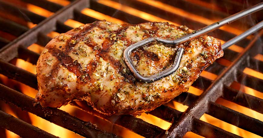 barbecue chicken being grilled on the barbecue