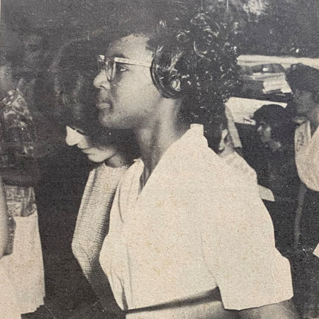 A photo of a woman in 1962 in a newspaper clipping. 