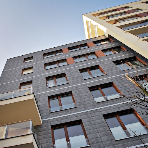 A stock image of a modern apartment building.