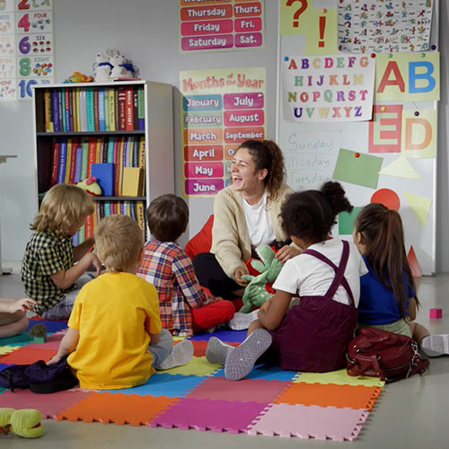 A teacher reading to elementary school students.