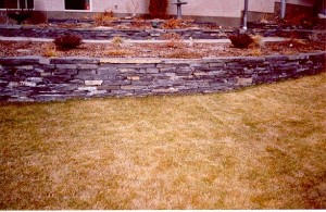 Multi-Tier Rundle Stone Retaining Wall Flower Beds for sloped yards