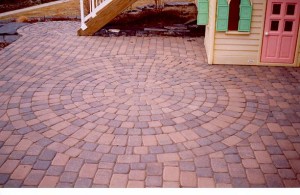 Multi-Color A/B Brick Pavers Circular Patio Design for a clean kids play area