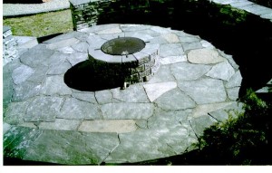 Plenty of room for chairs around a cozy BBQ fire in this Rundle Stone Circular Patio