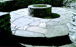 Sit inside or on top of the Stacked Rundle Stone Retaining Wall & Rundle Stone Slab Patio