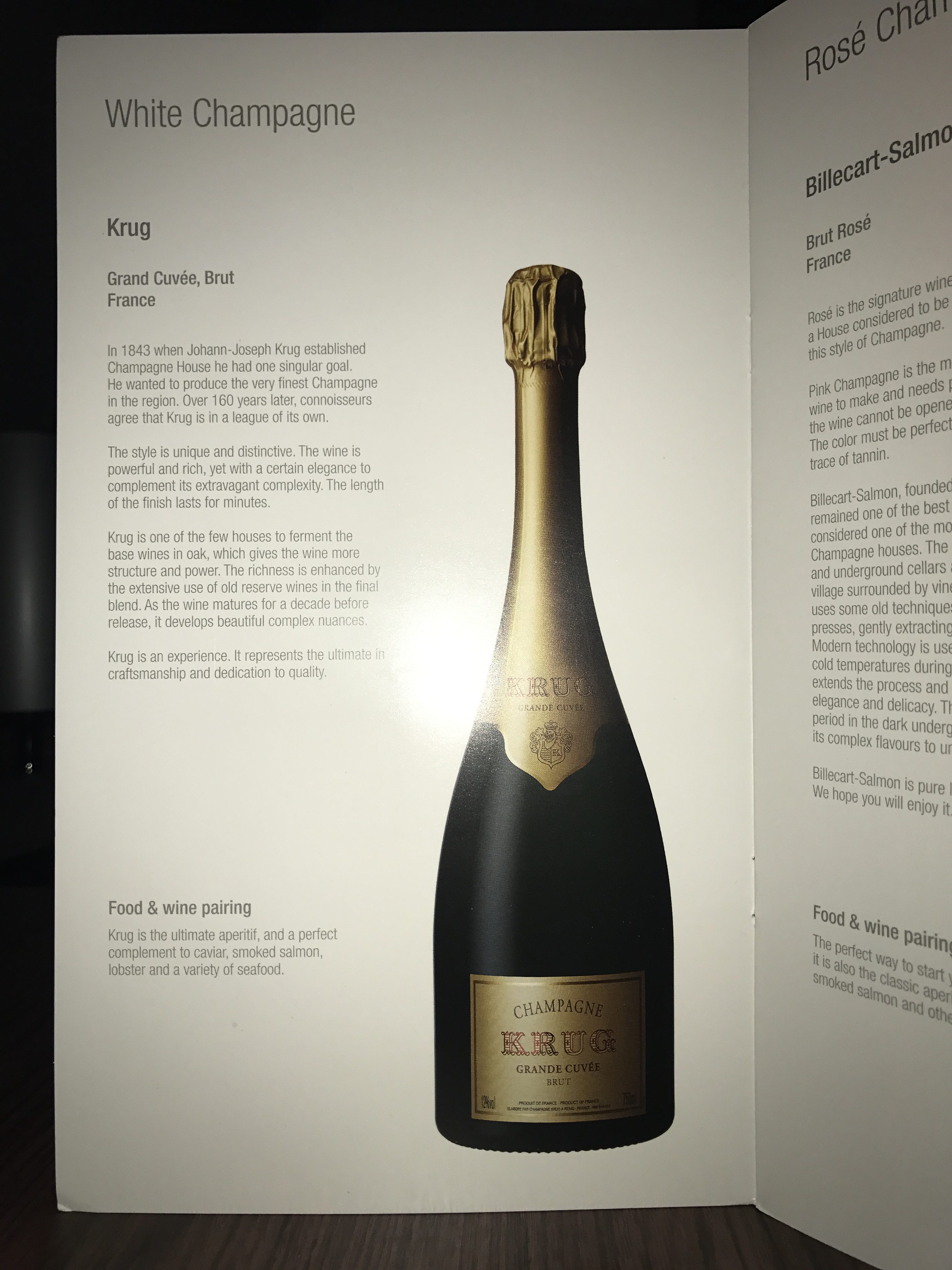 a menu with a bottle of champagne