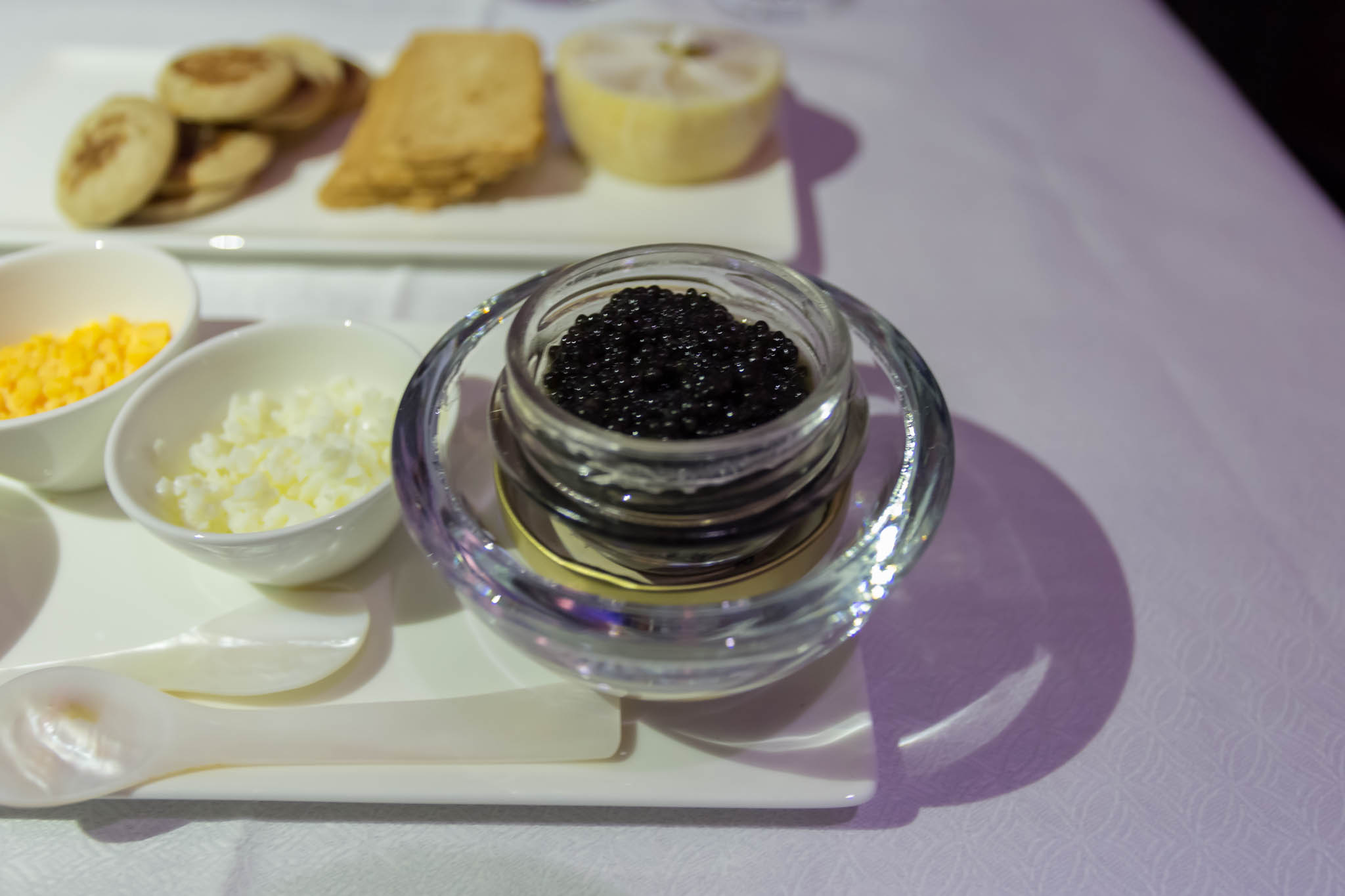 a bowl of black caviar and a bowl of cottage cheese