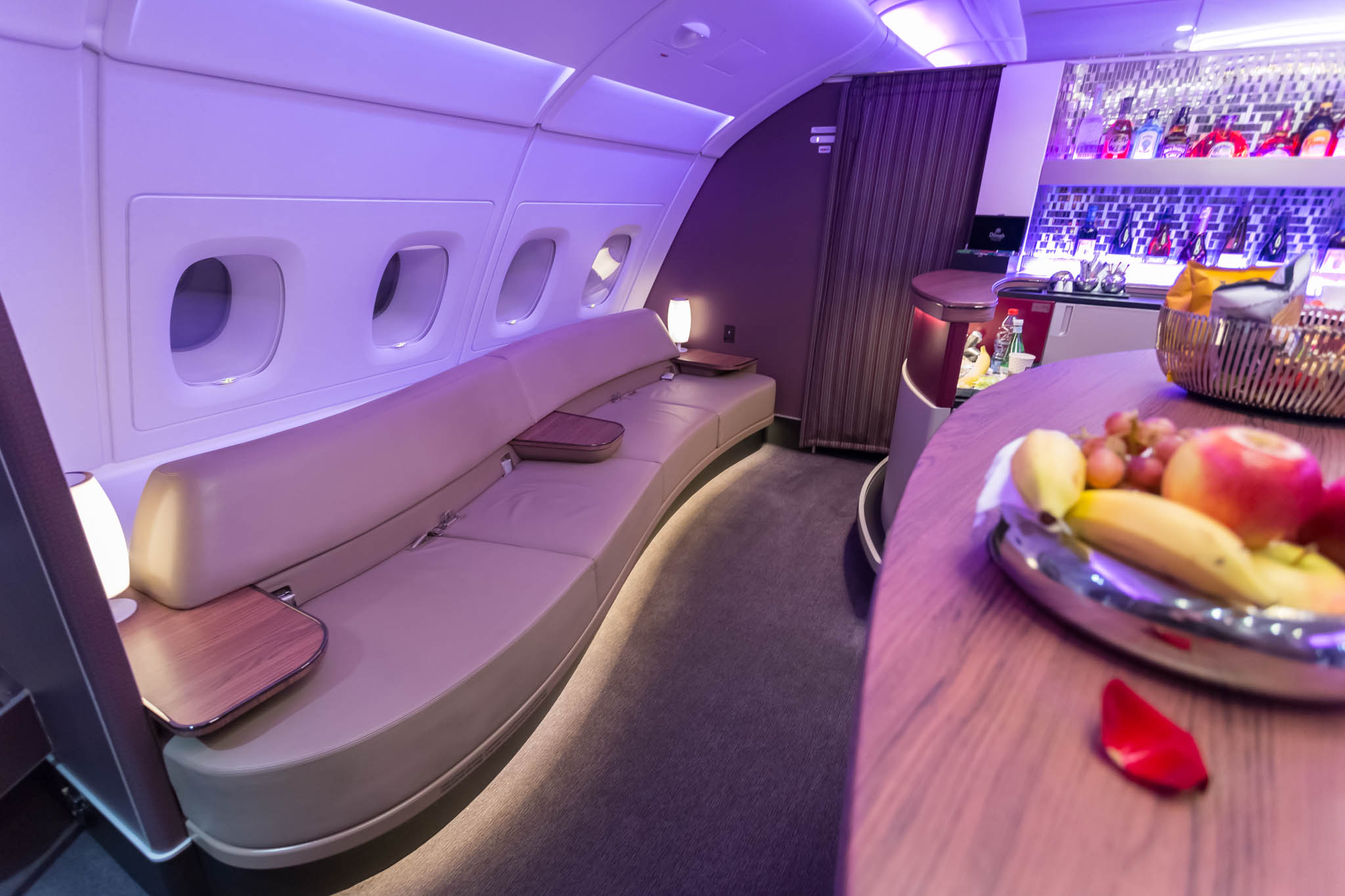 a table with fruit on it in the middle of an airplane