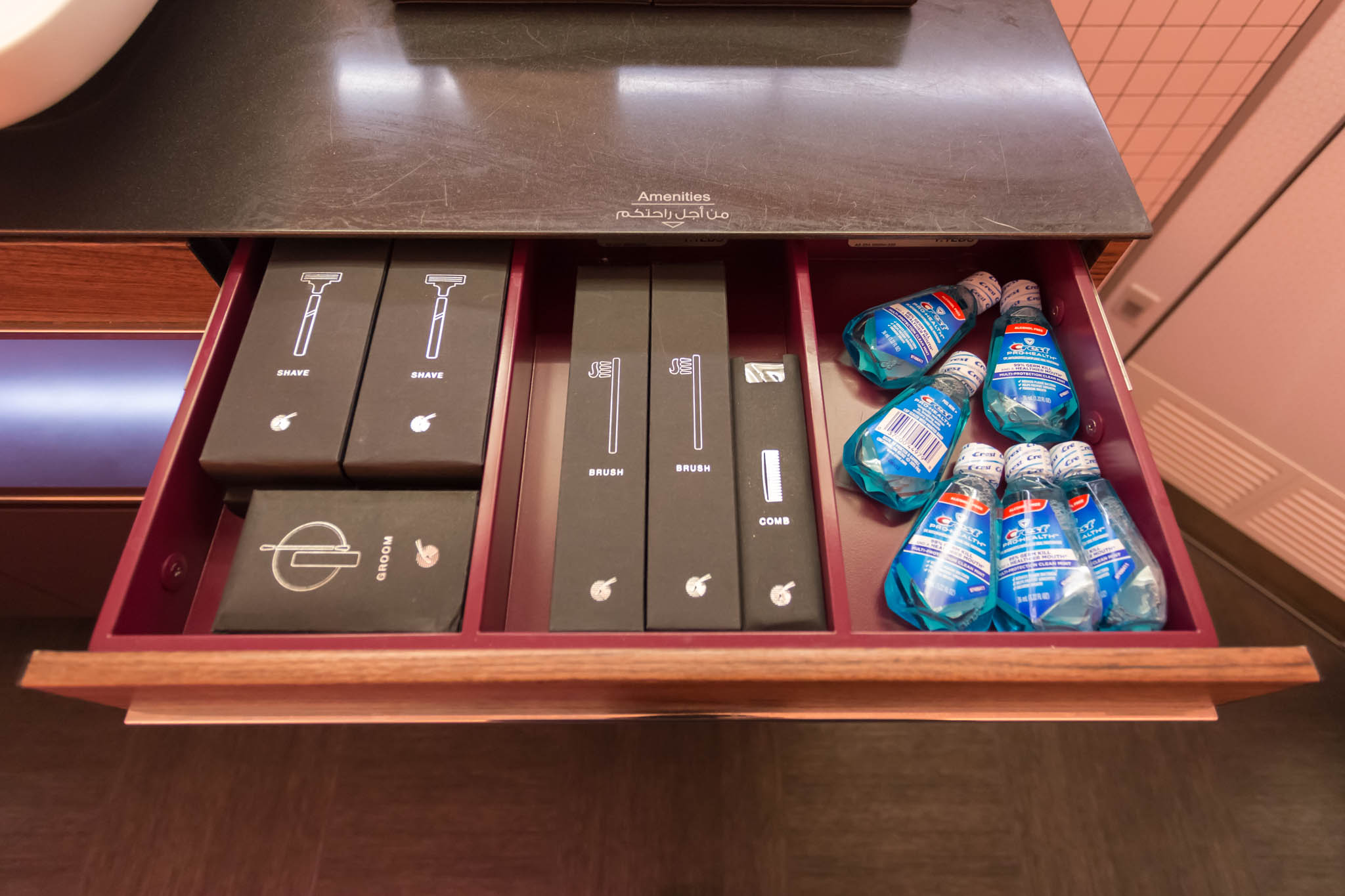 a drawer with a few boxes and bottles of toothpaste