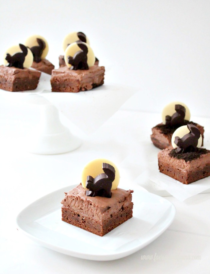 Halloween brownies with black cat silhouettes being served as a Halloween treat