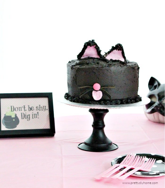 Easy Halloween Cake idea in dark black icing. An easy black cat cake for Halloween