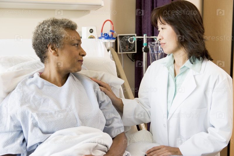 Doctor And Patient Looking At Each Other