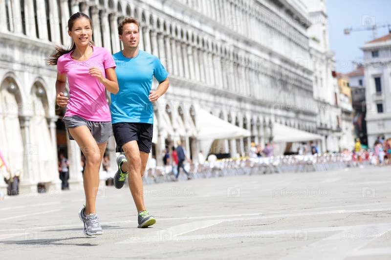 Running runner couple jogging in Venice