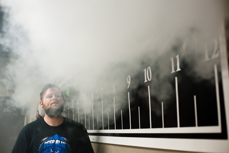 Clouds for Heroes contestant Jeremy Allen of Plano, Texas, blows his vapor cloud during competition.