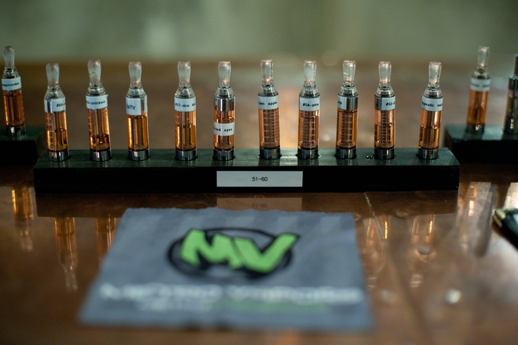 A line of liquid cartridges on display at Metro Vapors in Plano, Texas. Vaporizers convert the liquid, known as e-cigarette “juice,” into vapor, which contestants inhale and turn into clouds.