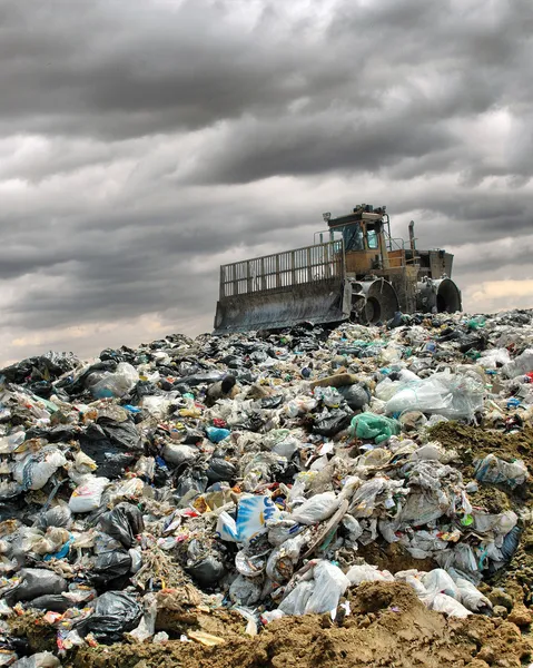 The bulldozer on a garbage dump