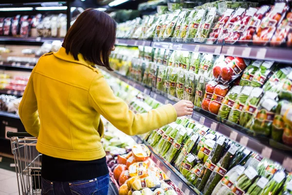 Young woman shopping in the supermarket