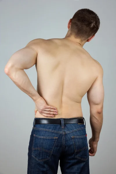 Young man with back pain