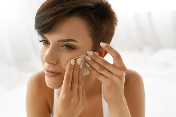 Skin Care. Woman Cleaning Face With Oil Absorbing Papers.