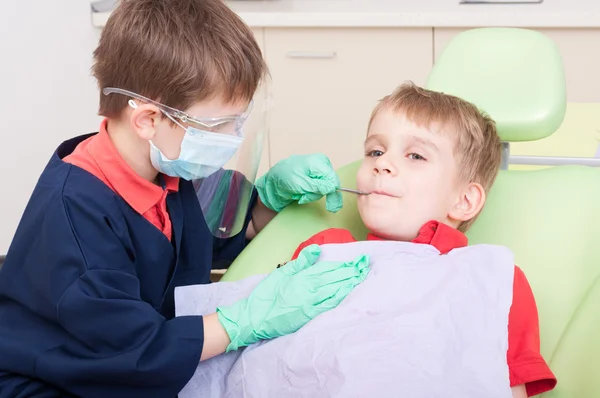 Kids acting as doctor and patient