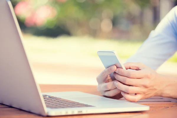 Woman hands holding, using smart, mobile phone and computer