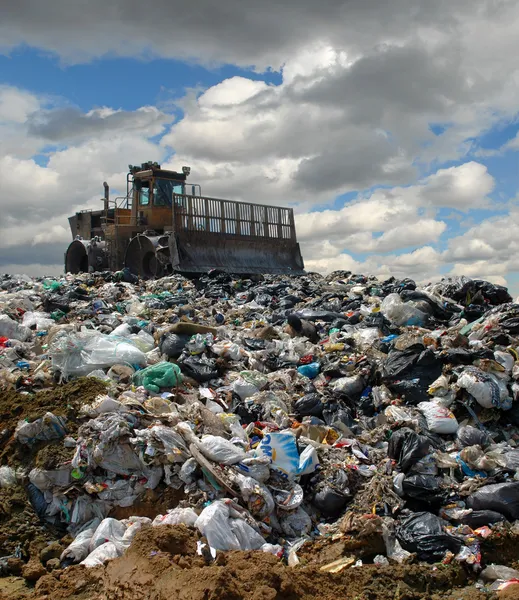 The bulldozer on a garbage dump