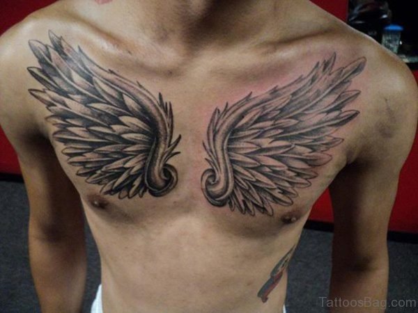 Black And Grey Wings Tattoo On Man Chest