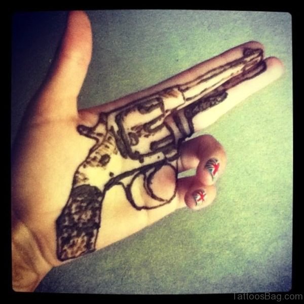 22 Wonderful Gun Tattoos On Finger