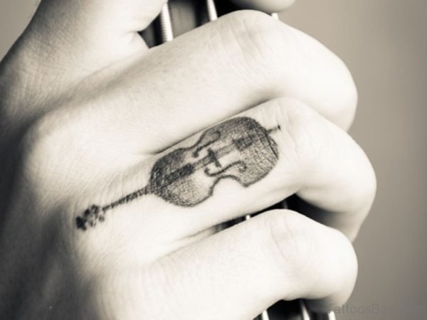 7 Tiny Guitar Tattoos On Finger